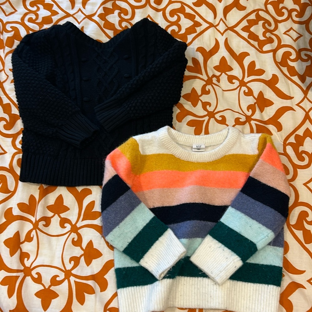 Set of 2 baby Gap crewneck Sweaters - one is black, one is colorful stripes.